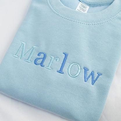 custom kids personalised jumper sweater  in blue with blue mix of threads with name on it