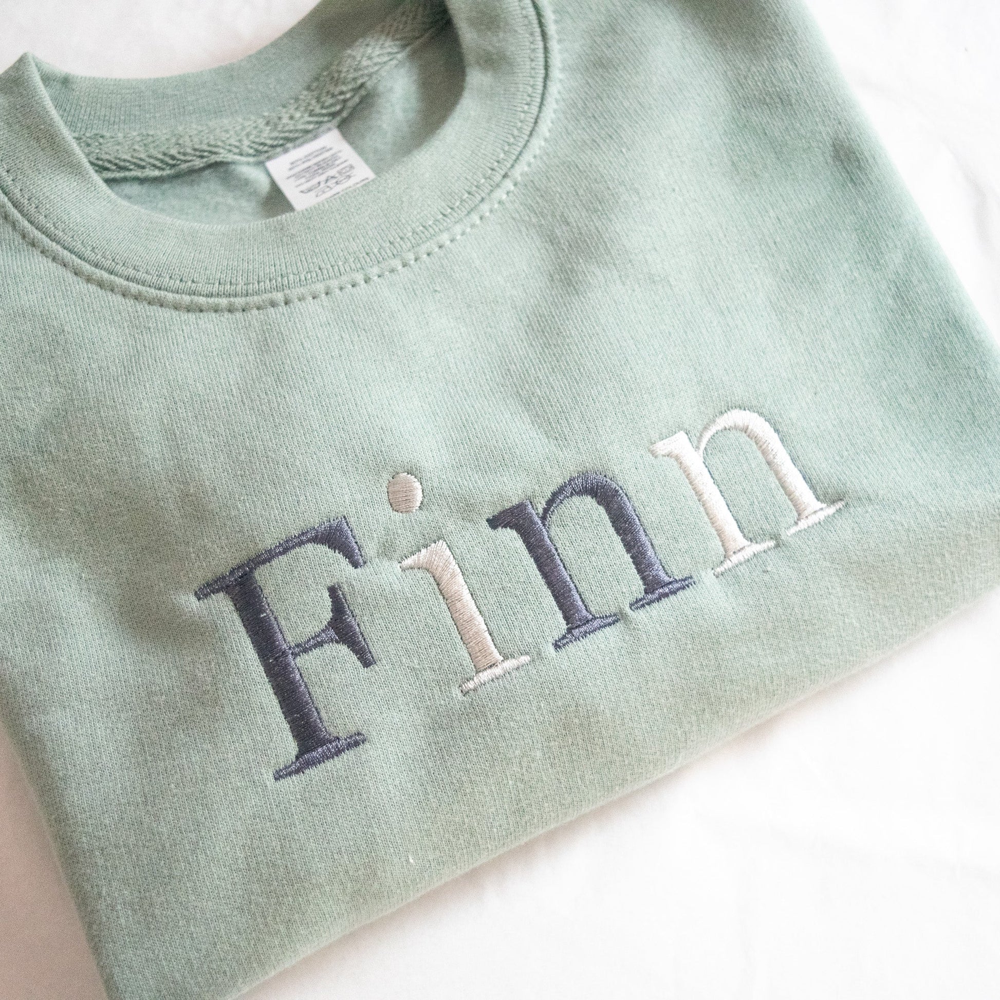 childrens jumper embroidered with any name or slogan with monochrome thread colours oversized and comfy