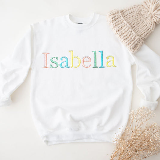 kids custom embroidered personalised jumper in lavender with rainbow pastel thread