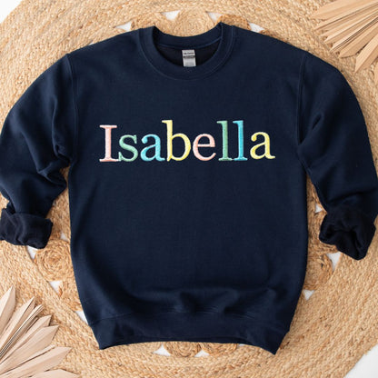 kids custom embroidered personalised jumper in French navy with rainbow pastel thread
