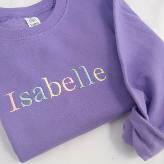 kids custom embroidered personalised jumper in lavender with rainbow pastel thread