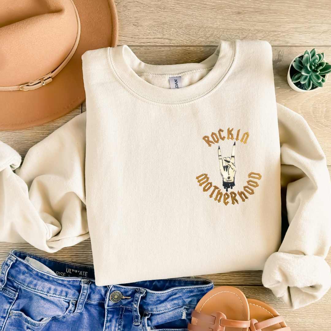 rockin motherhood sweater with rock hand symbol